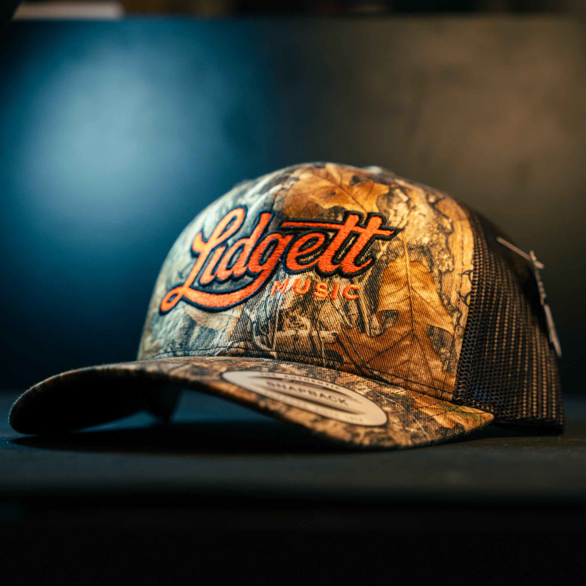 Lidgett Music Camo Hat - Blaze Orange Logo